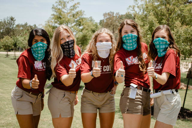 girl staffers thumbs up