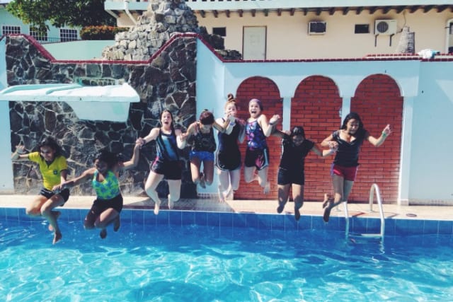 missions campers jumping into pool