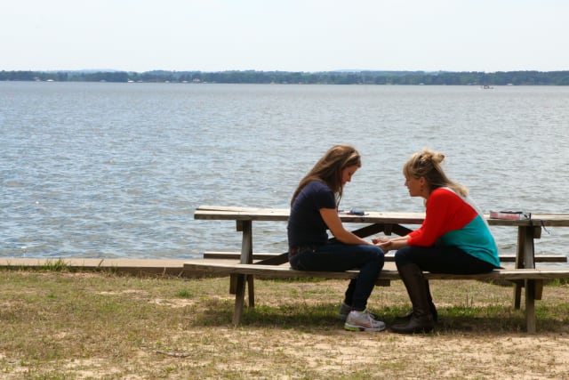 Mom and daughter praying