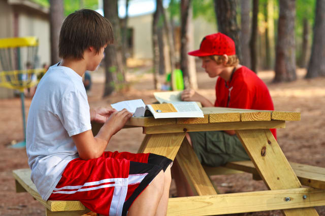 Campers reading bibles