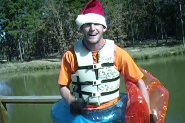 Camper on the dock in Santa Hat