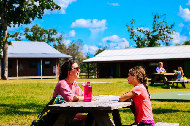 Camper and counselor spending time together