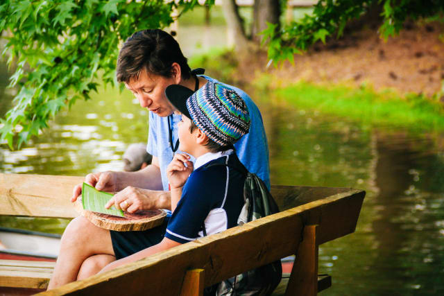 Father and Son talking on the Woods Dock