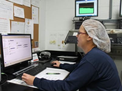 Production employee working on a computer
