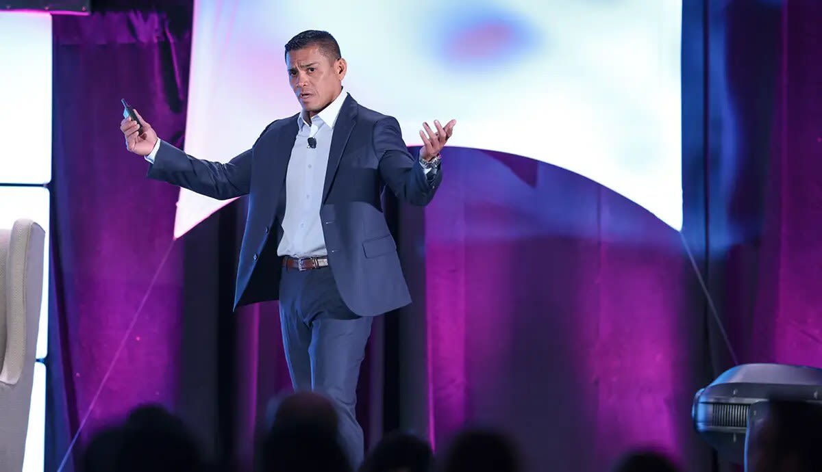 Dr. Mark Costes addressing DSP partner dentists at a conference