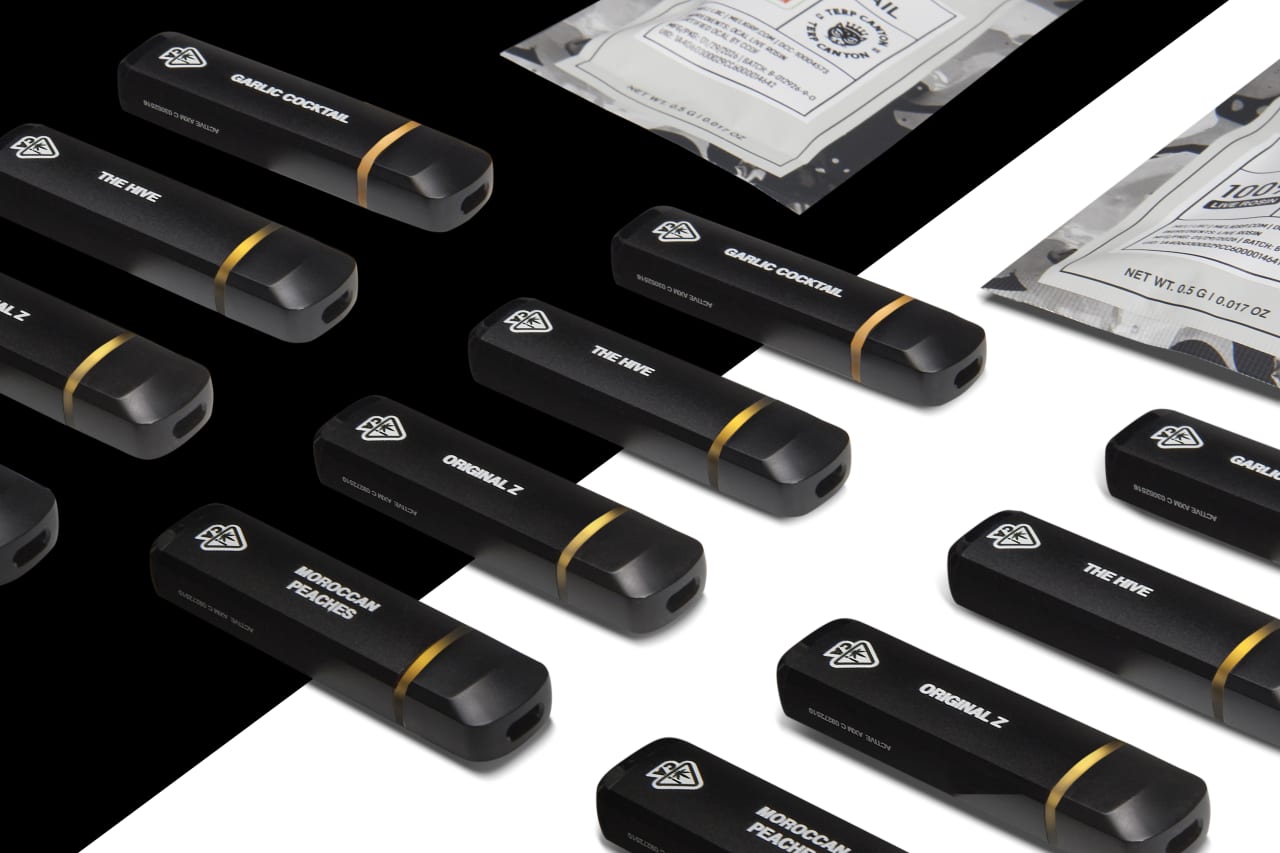 Pistil Whip All-In-One live rosin vaporizers laid out on a black and white surface