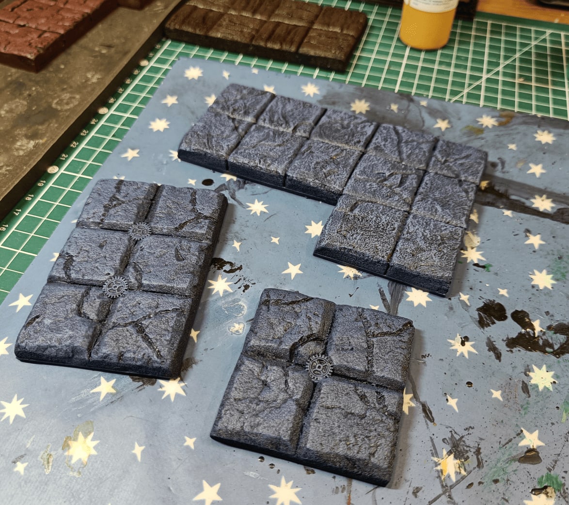Blue maintenance room tiles with small gears after overbrush and drybrush