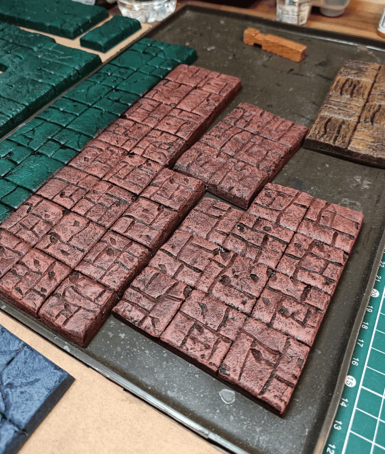 Lighter red almost orange drybrushed over red section