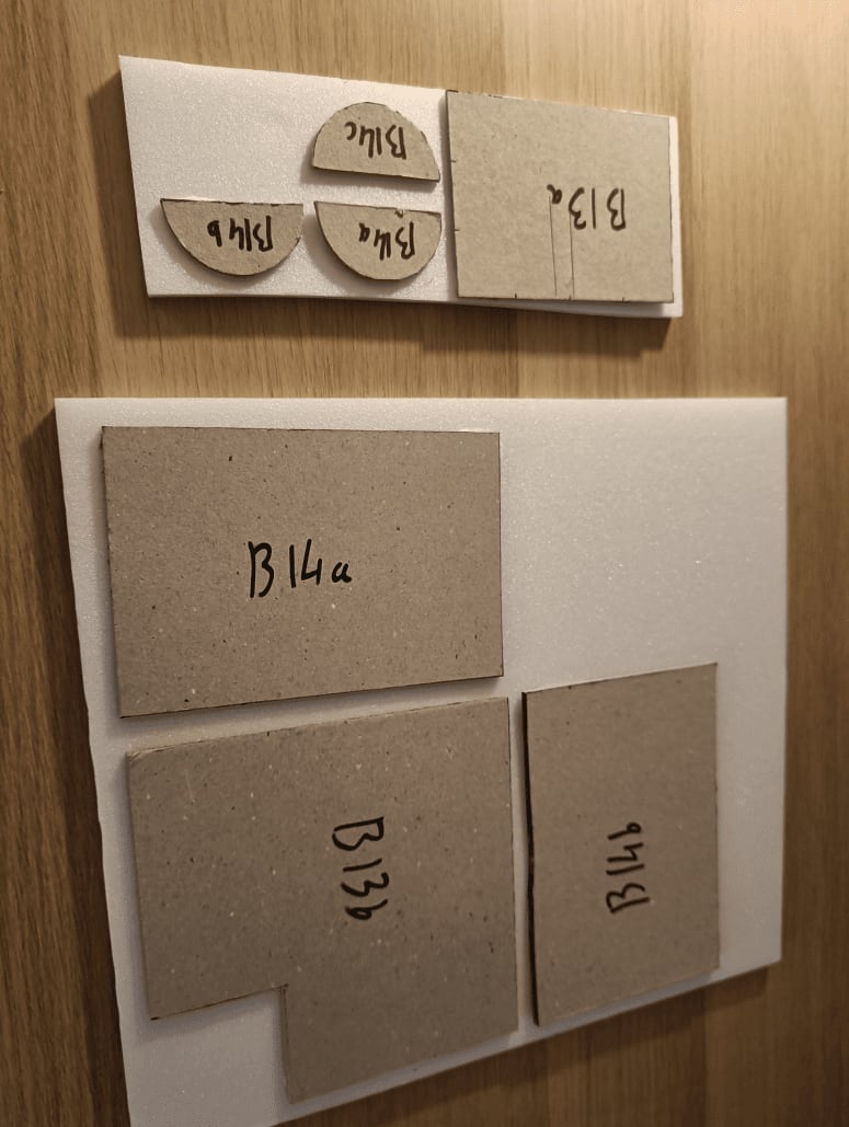 Cardboard templates glued onto foam boards for precise cutting