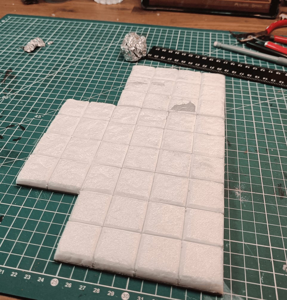 Aluminum foil ball rolled over surface creating stone texture