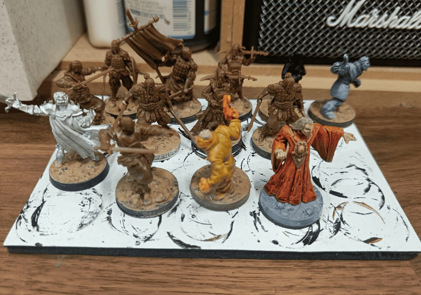 Texture mixture applied to miniature bases with wet brush technique