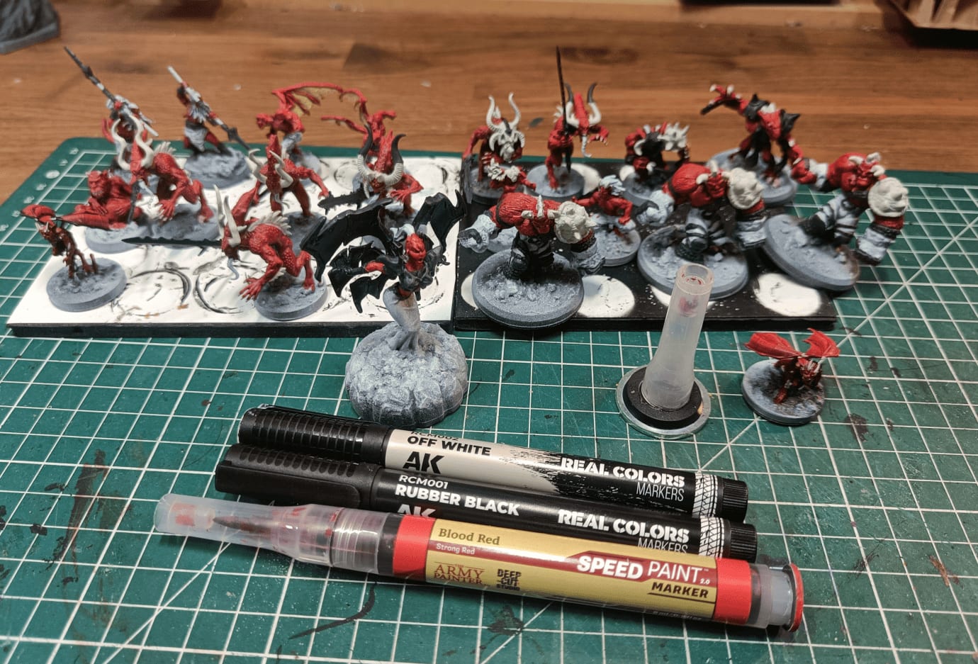 Devils with black armor and off-white bone details using markers