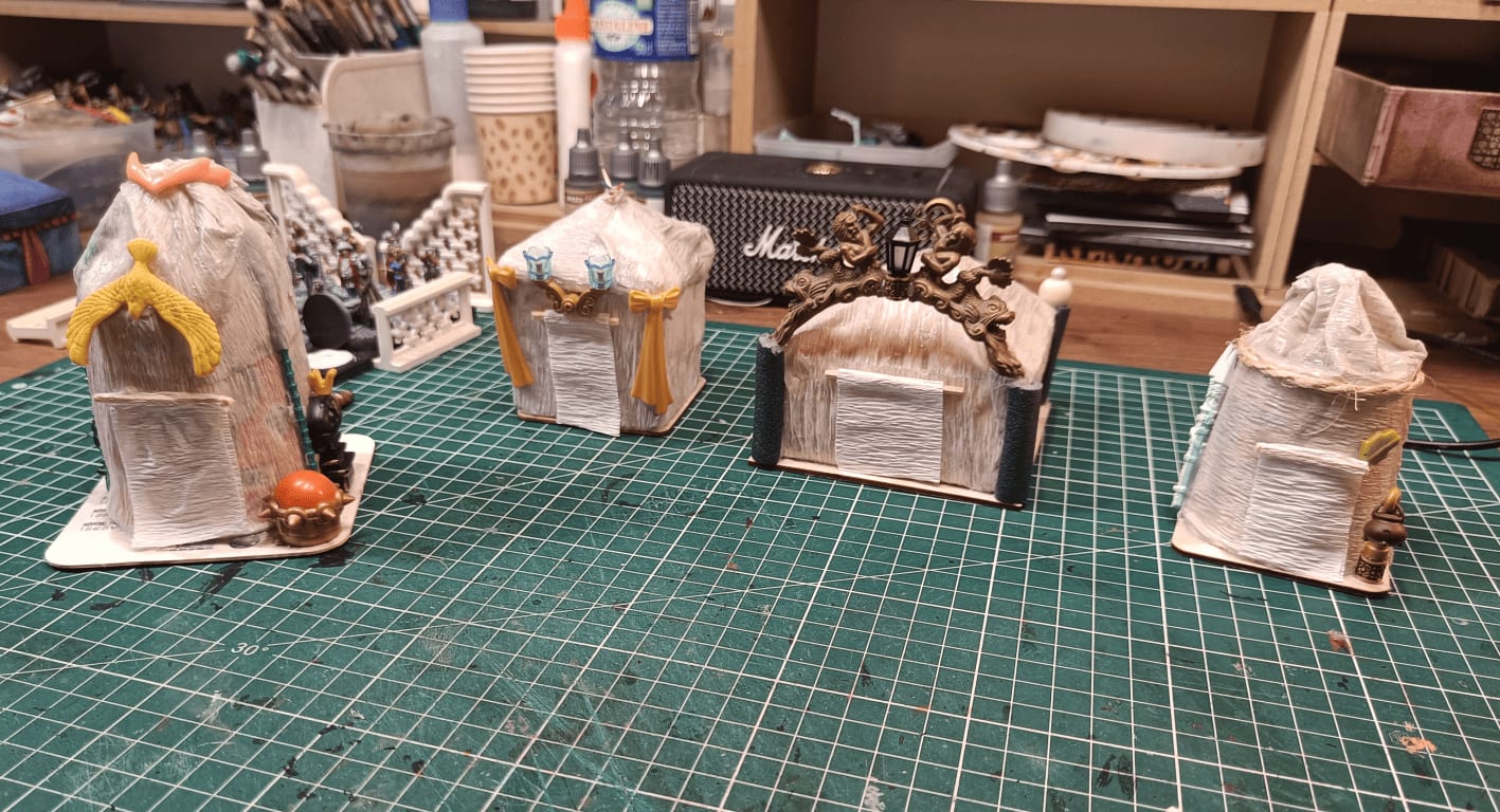 Tent structures made with cardboard cups and foam covered in crepe paper