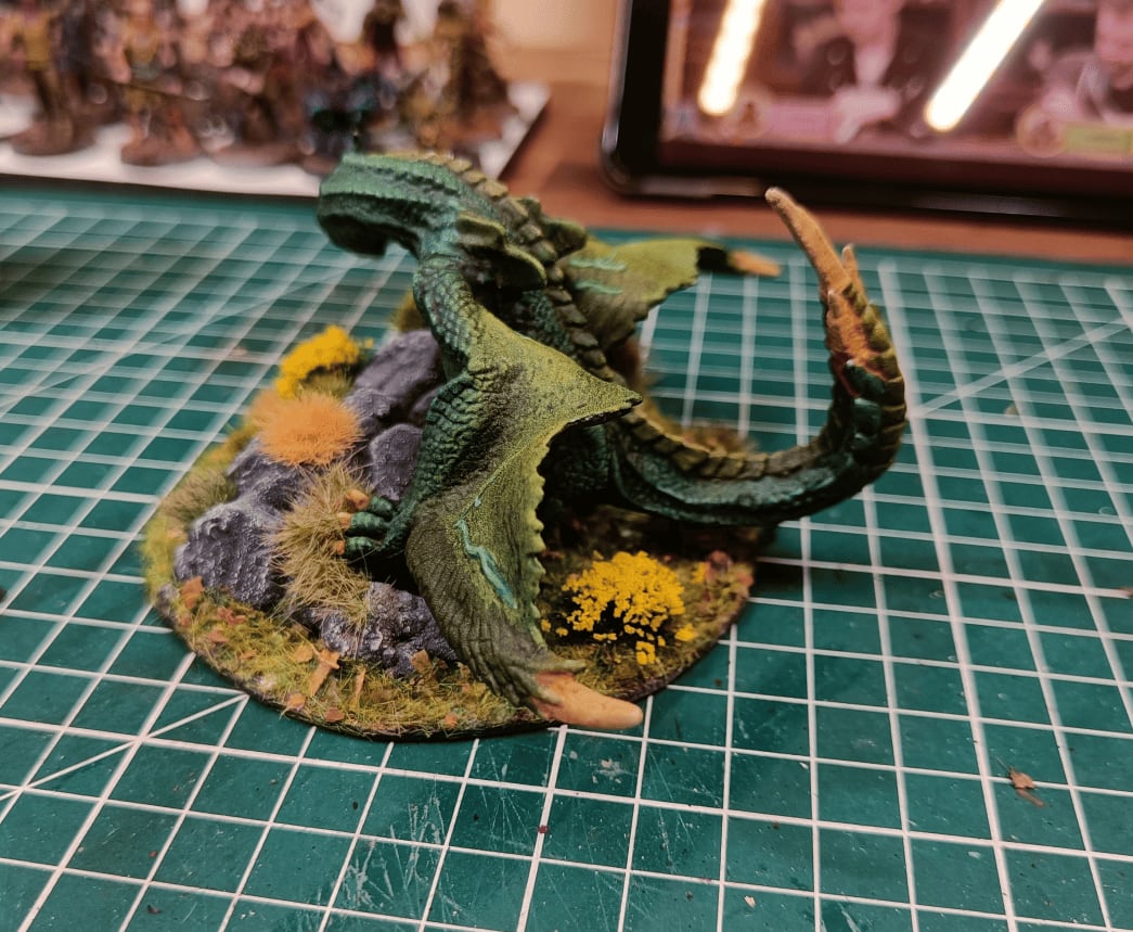 Back view showing green wings and scales with drybrushing effects