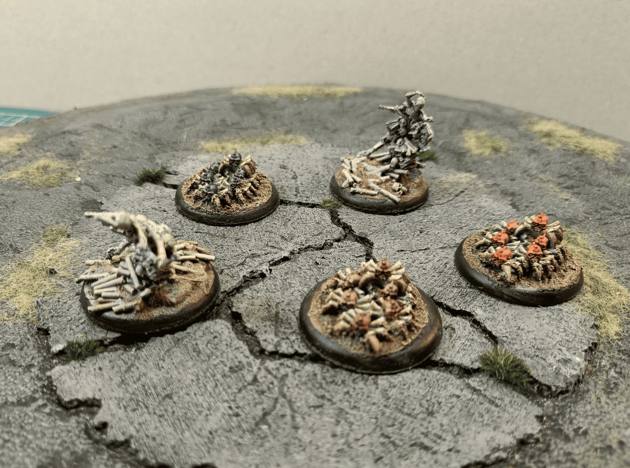 Collection of undead swarm miniatures including bone waves and spider-skulls