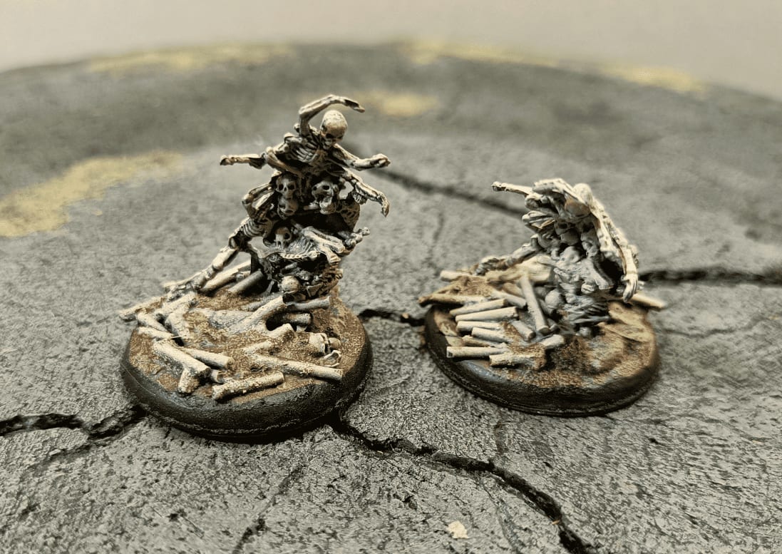 Reaper Bones bone swarm miniatures on circular bases