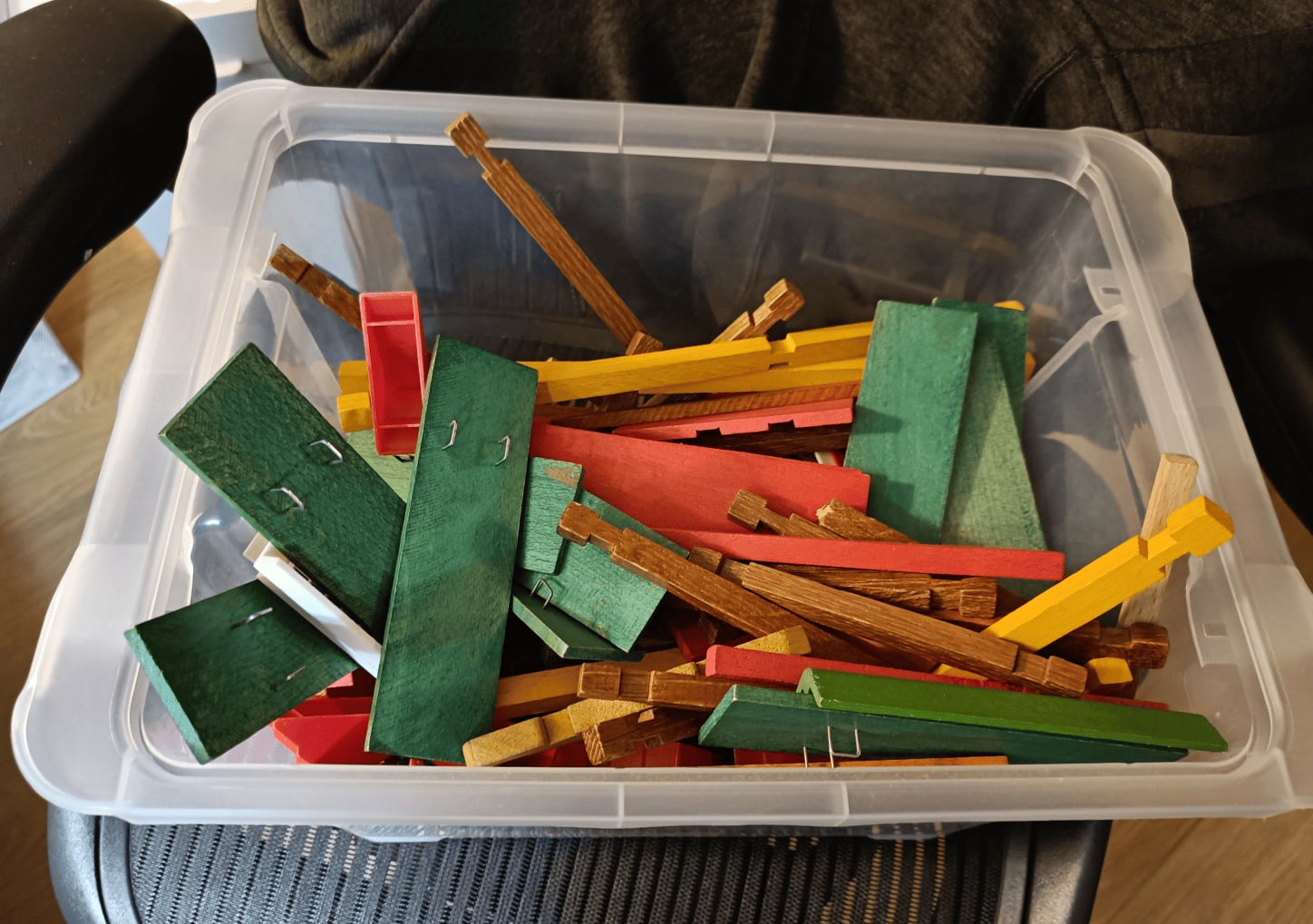 Wooden construction set with interlocking sticks