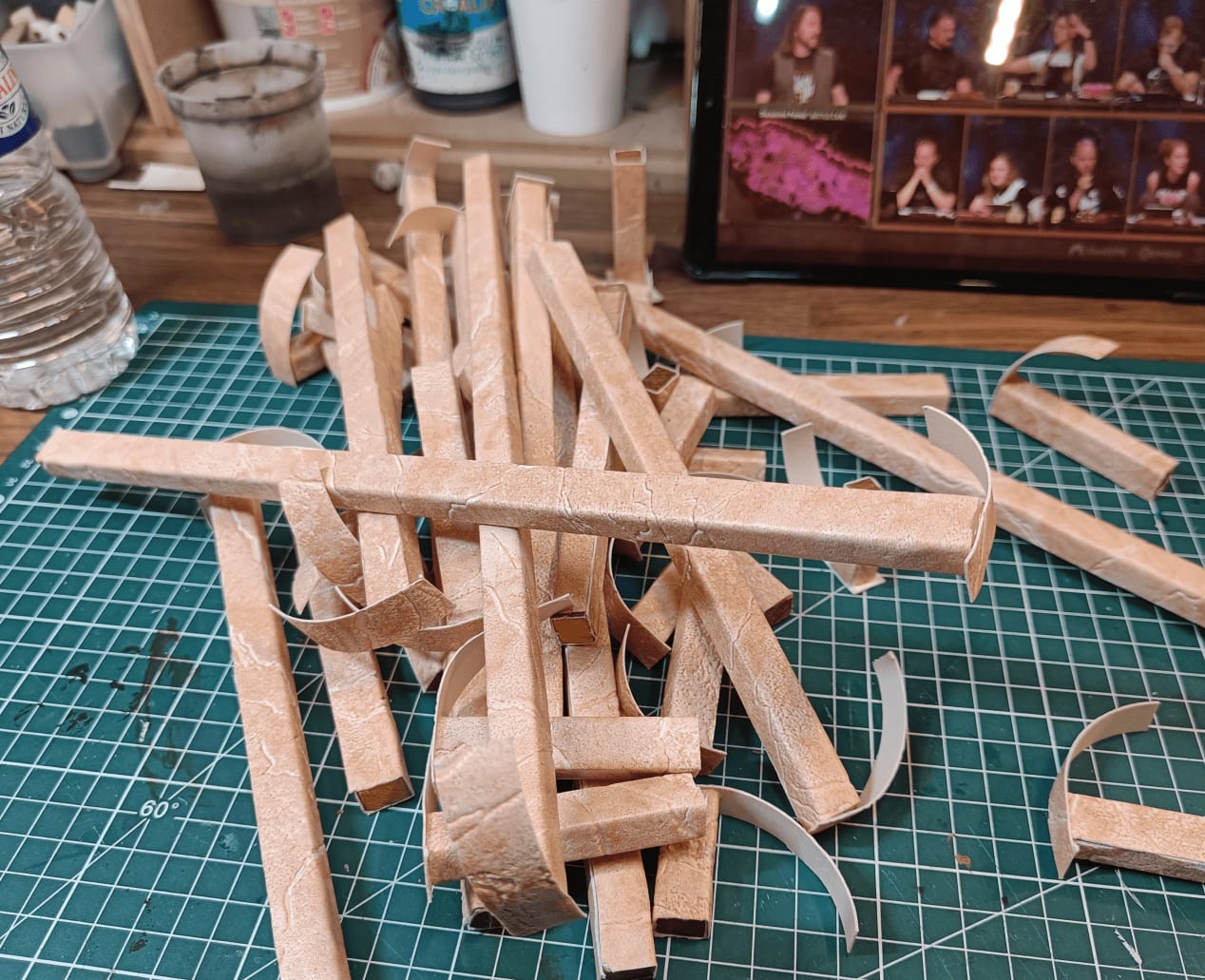 Adding wallpaper texture to stick ends with glue gun