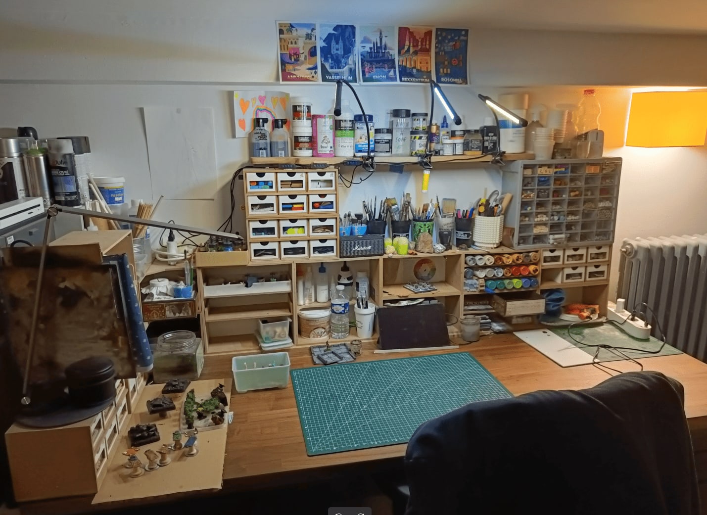 Final workspace setup with modular storage and organized paint station