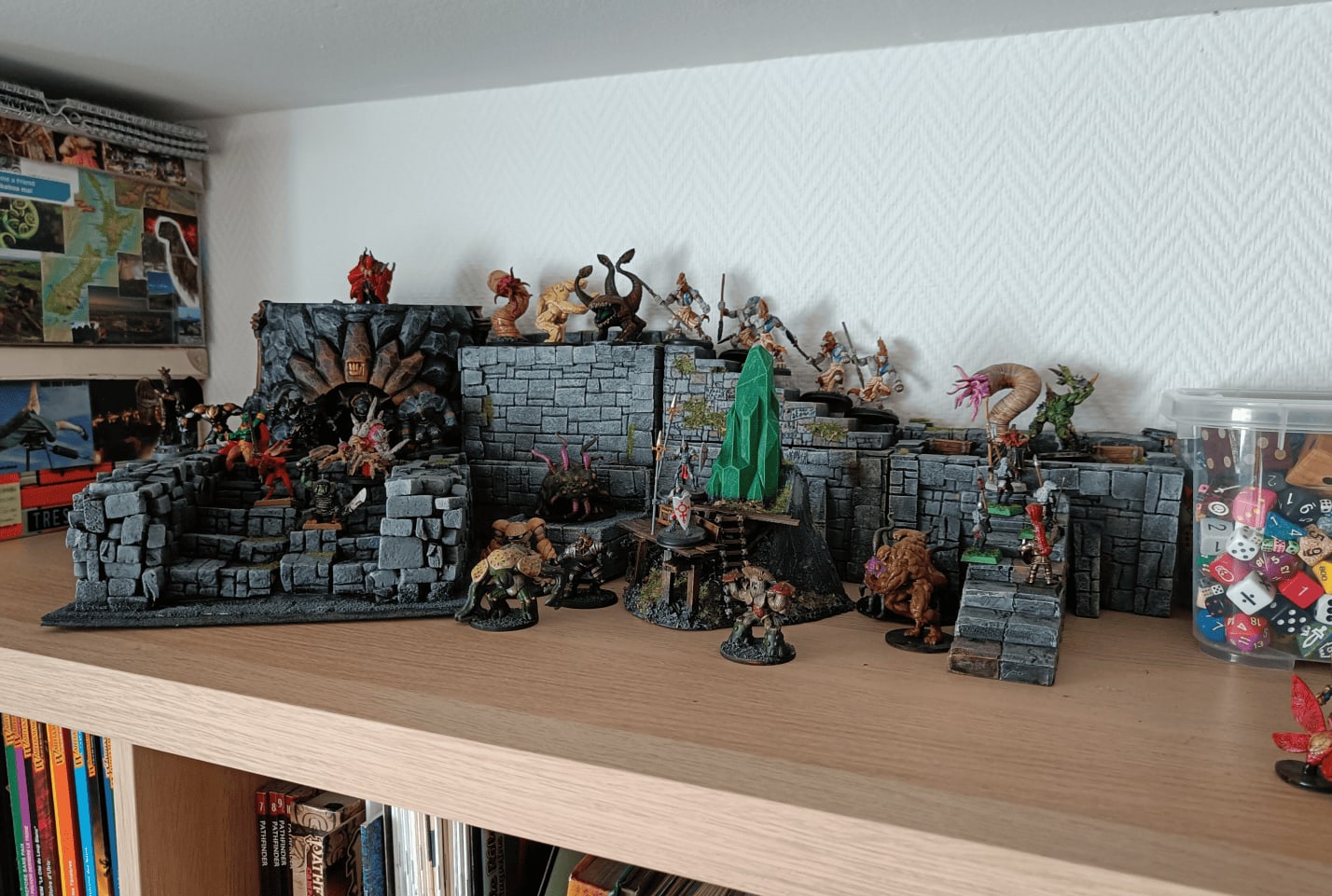 Diorama display with painted miniatures on shelf top