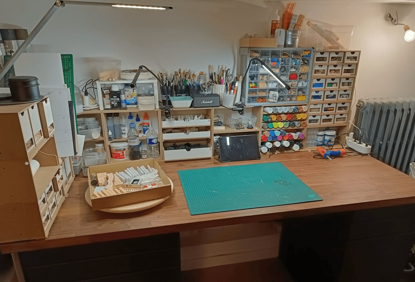 Workspace with horizontal paint storage and brush collection