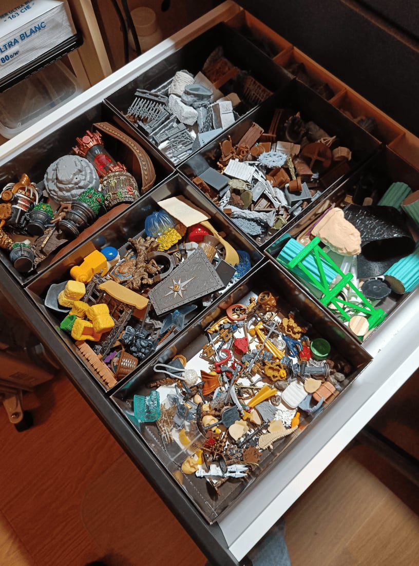Drawer with boxes sorting scatter terrain by size and quality