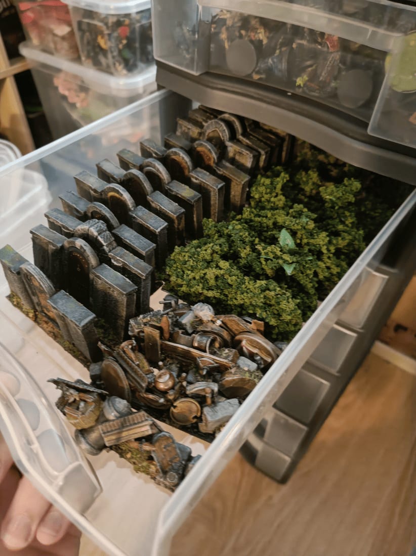 Drawer shelves storing organized Zombicide 3D terrain pieces