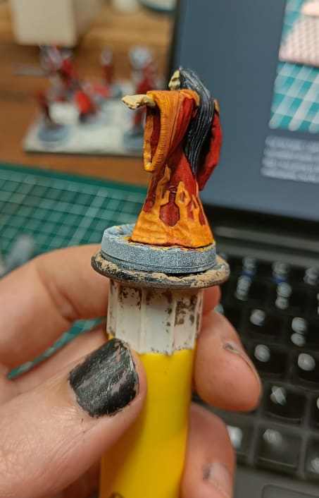 Back view showing yellow coverage struggles over red base