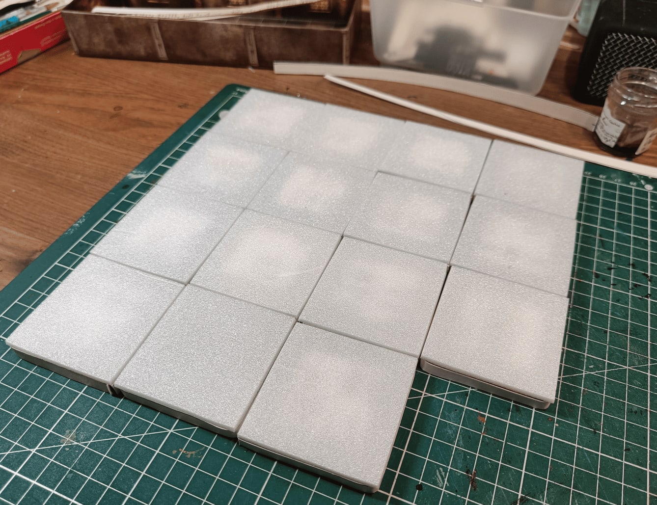 Tiles glued to foam sheet and cut flush with cutter