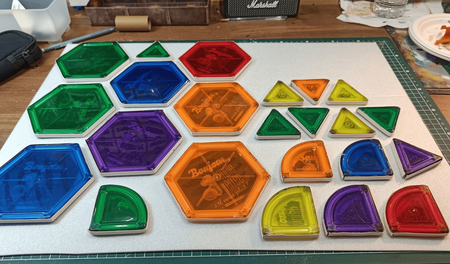 Special shapes including hexagons, triangles, and curves glued to foam