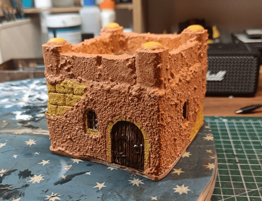 First house painted in orange-pink colors that didn&rsquo;t work well