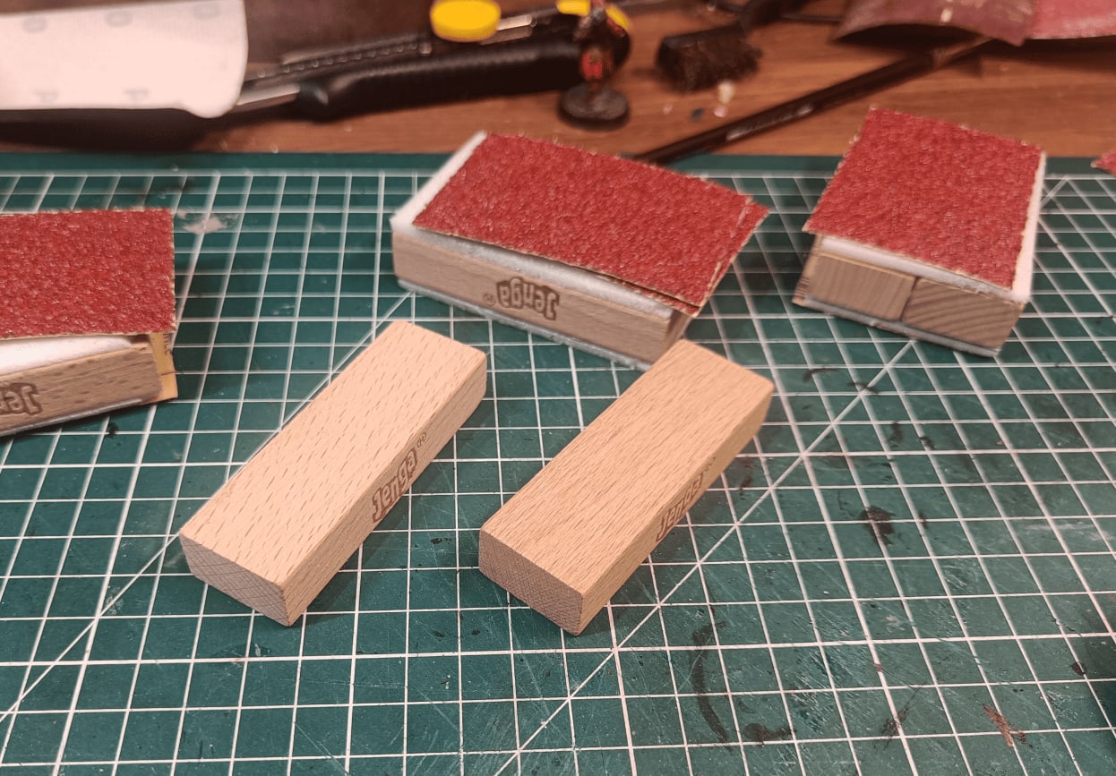 Stacked Jenga blocks with foam and sandpaper for alleyway walls