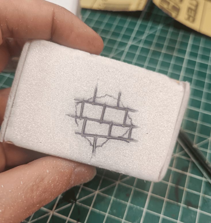 Wall section showing holes revealing brick texture underneath