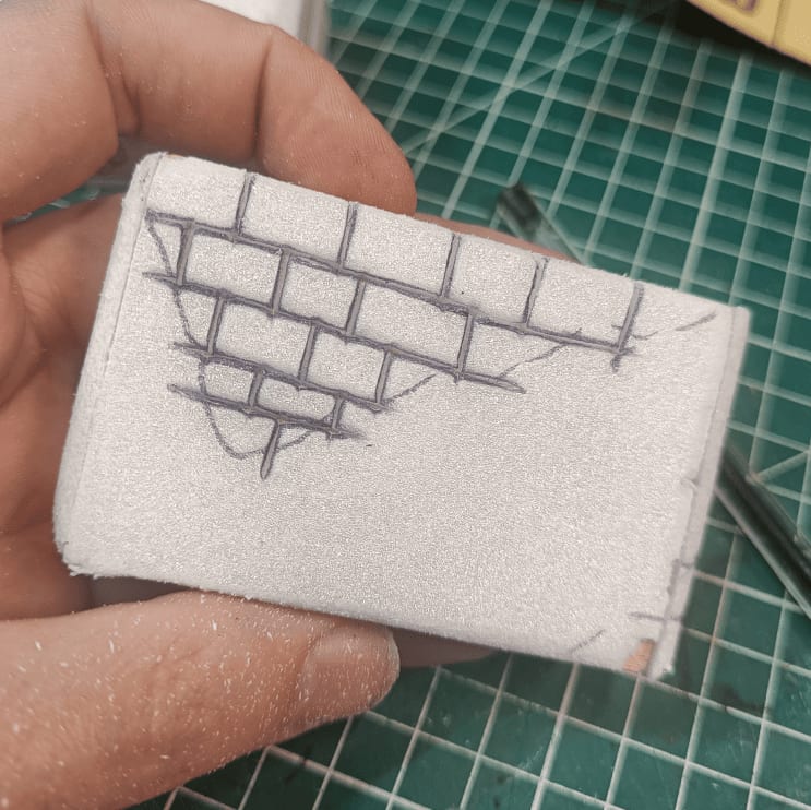 Wall with various torn holes creating broken appearance