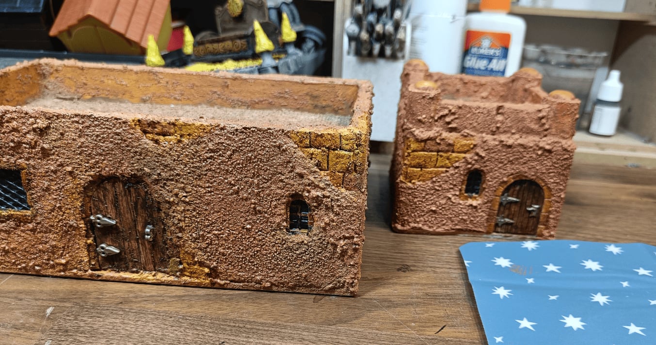 First buildings painted in pinkish colors with drybrushing
