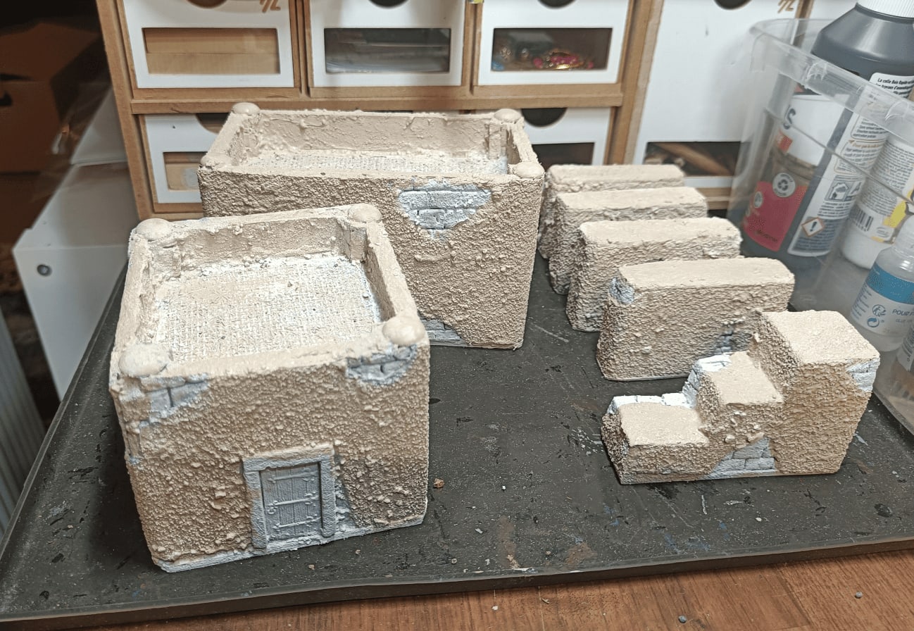 Buildings painted with improved tan and white color scheme