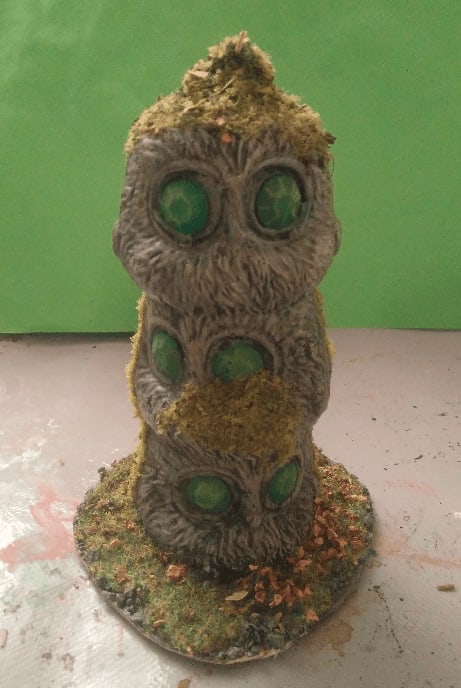 Three-headed bird statue