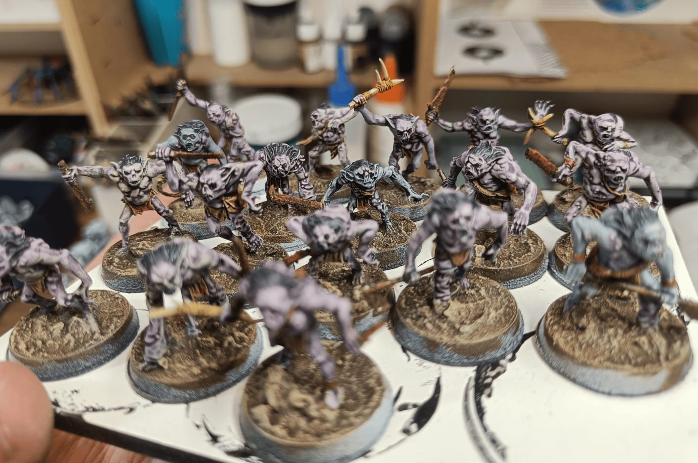 Detailed painting with hair, leather loincloth, and bone weapons