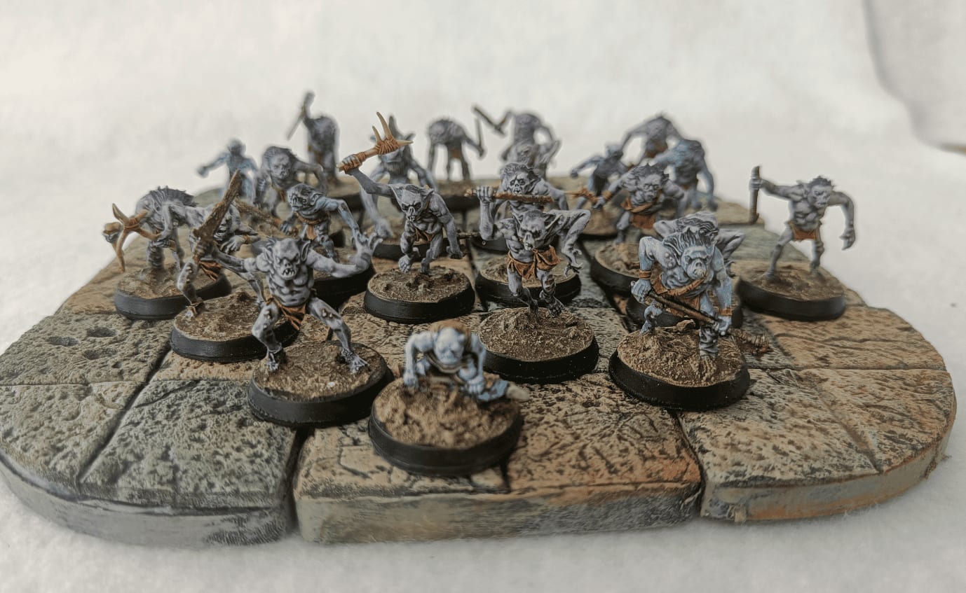 Troglodytes positioned as if emerging from canyon walls in desert encounter