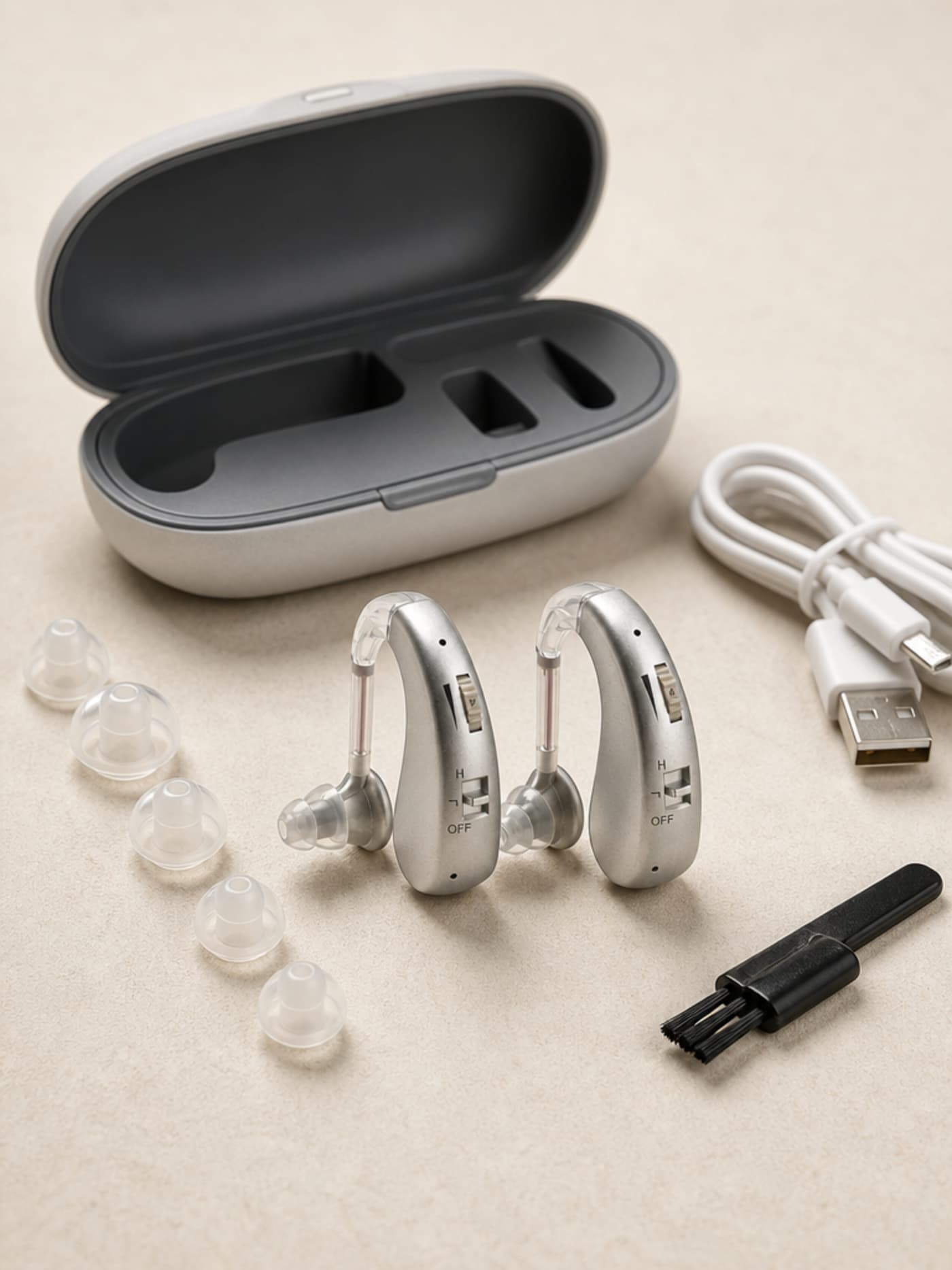 Audexa Hearing Aids complete package — twin BTE units with all included components laid out