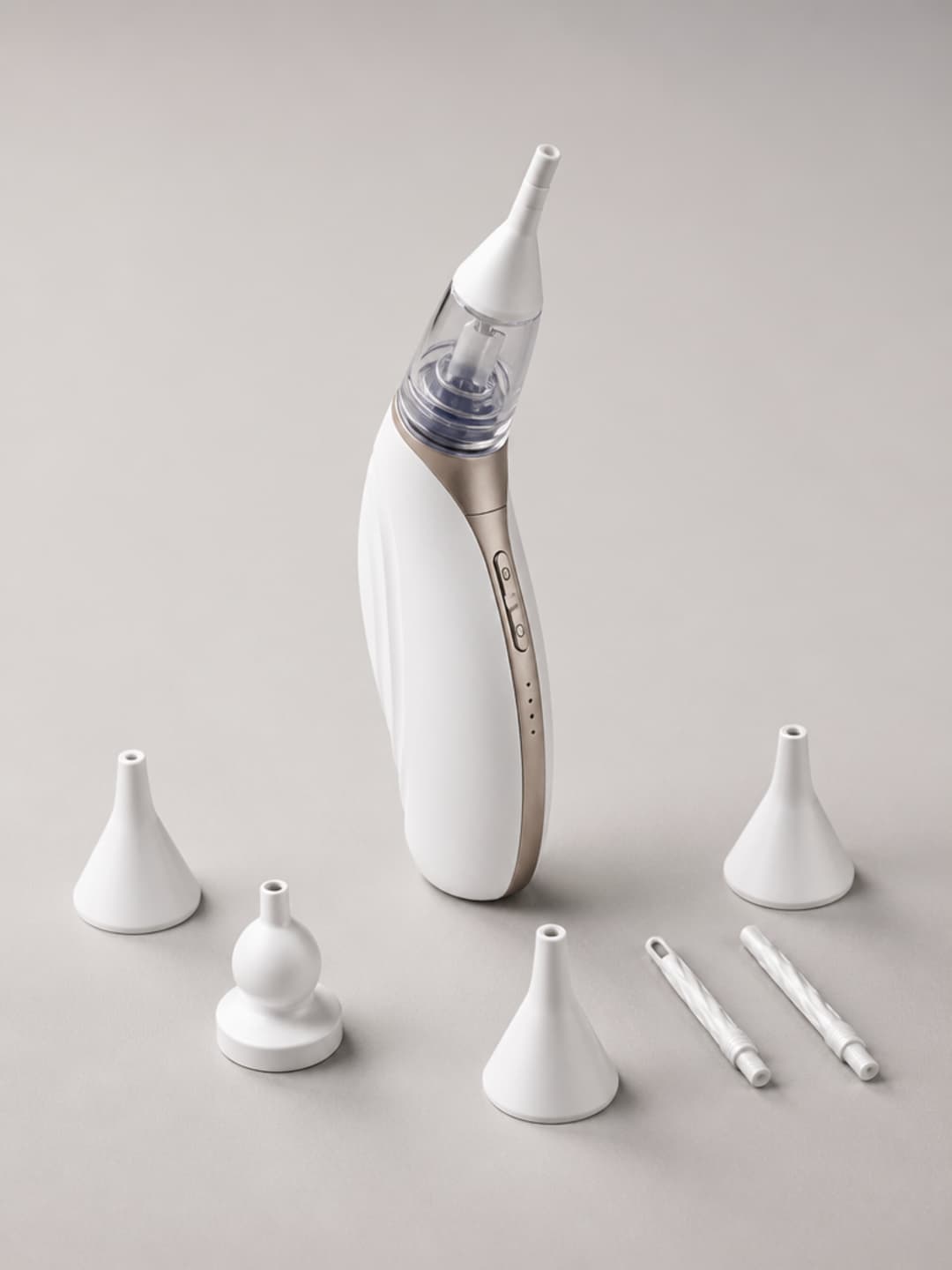 Vacurio complete kit — device upright with all five silicone tip variants arranged around it