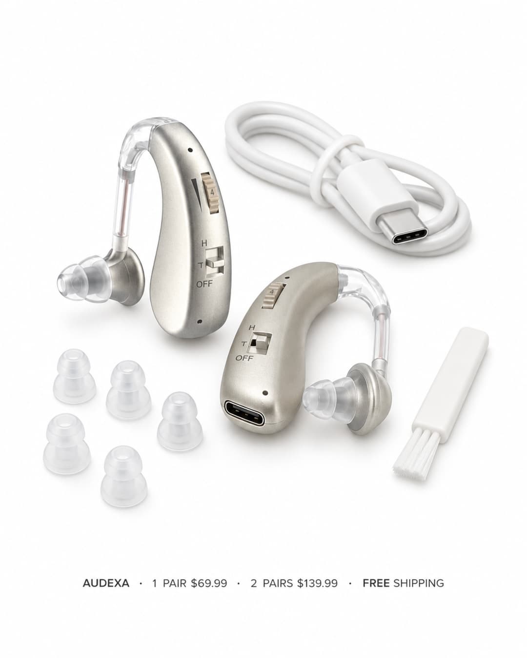Audexa kit containing two champagne-colored behind-the-ear hearing aids, silicone ear tips in different sizes, a USB cable, and a cleaning brush.