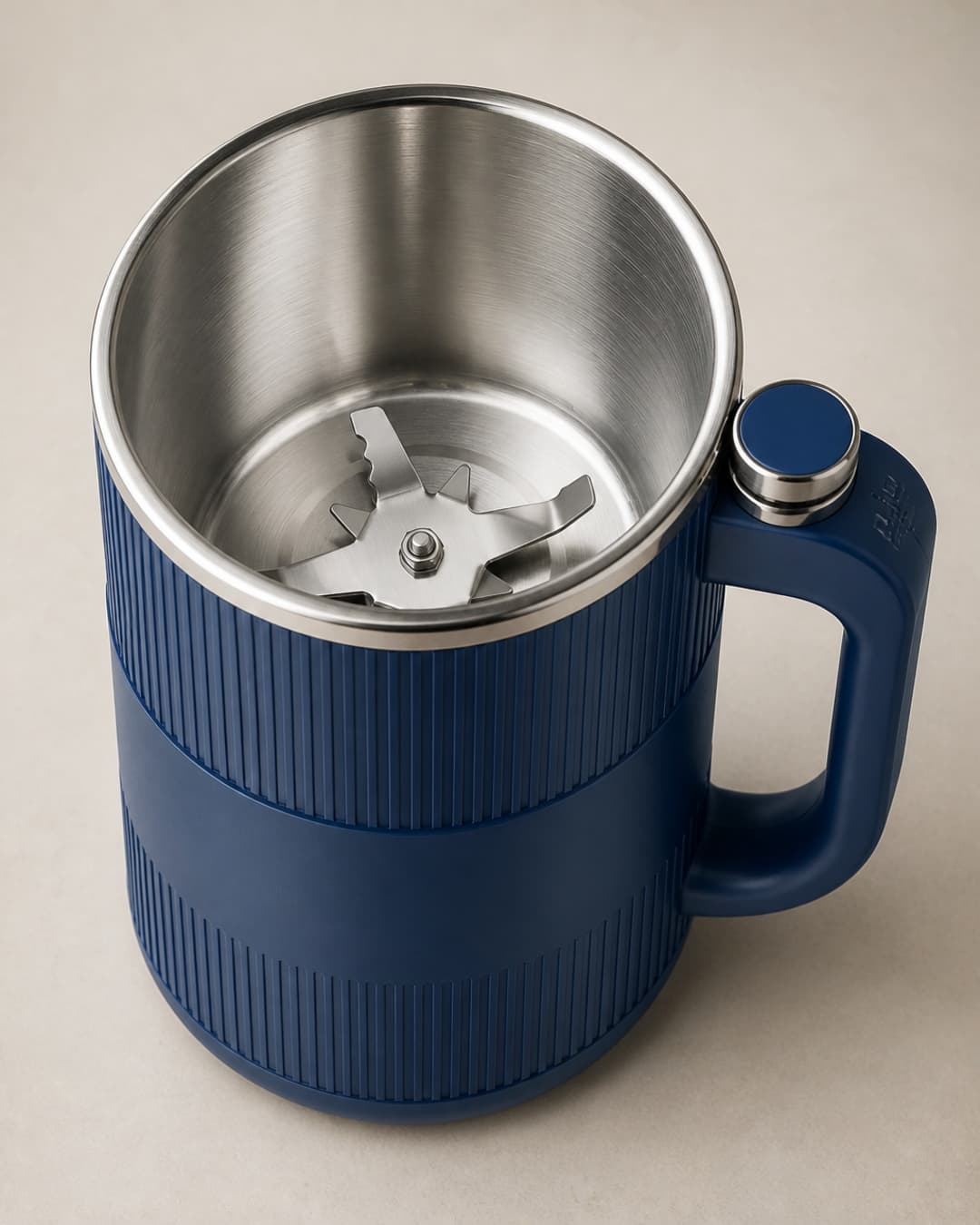 Overhead view of GRAIN BLOOM stainless milling cup and blade assembly