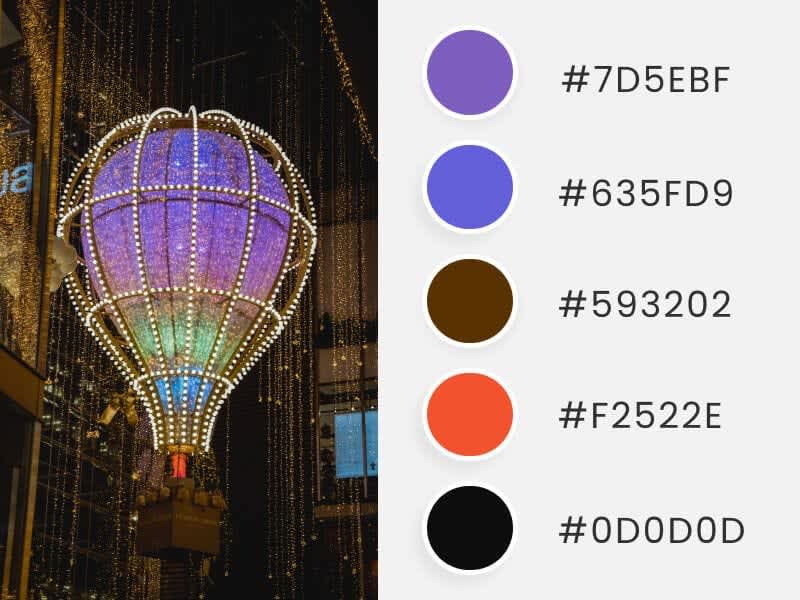 A hot air balloon of colored lights captured in a photograph, accompanied by colored circles showing their corresponding HEX codes.