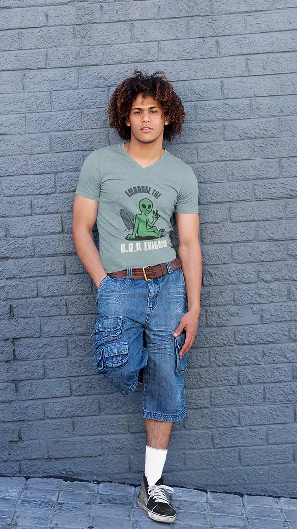 v-neck-tee-mockup-of-a-man-leaning-against-a-gray-concrete-wall