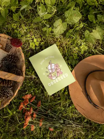 Cottagecore-Themed Mockup of a Postcard Lying on the Grass