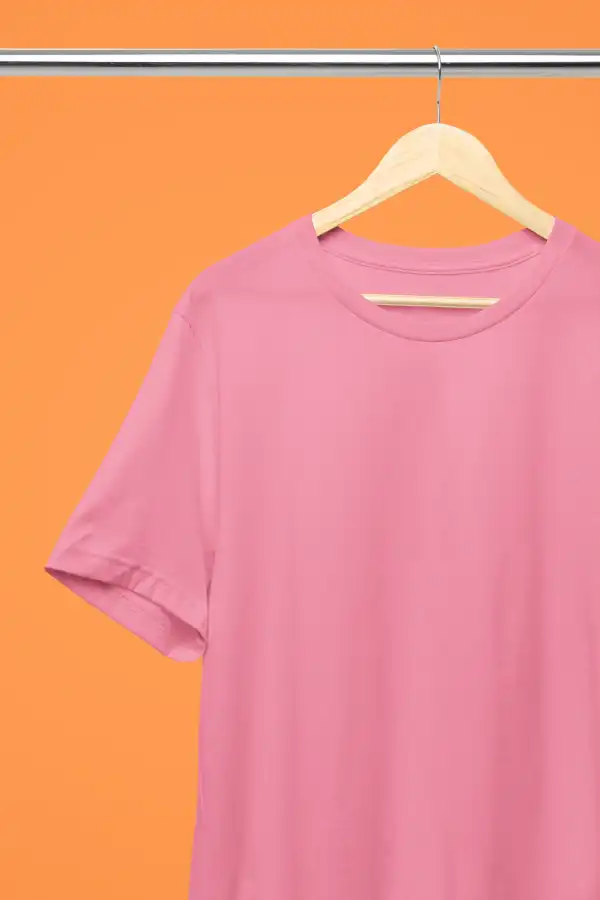 Stunning Bella Canvas 3001 Charity Pink T-Shirt Mockup Featuring a Bright Tangy Orange Background