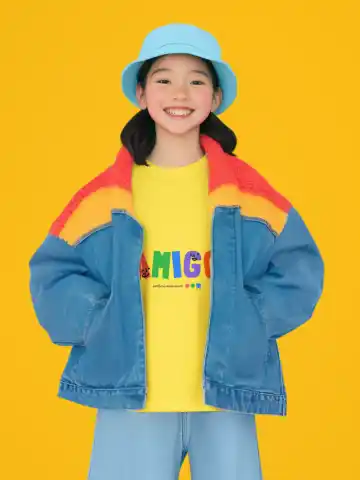 T-Shirt Mockup Featuring an AI-Created Happy Girl Posing in a Colorful Studio