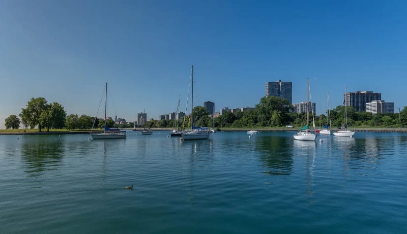 Sailboats moored in Montrose Harbor with lakefront high-rises on Chicago's North Side in the background