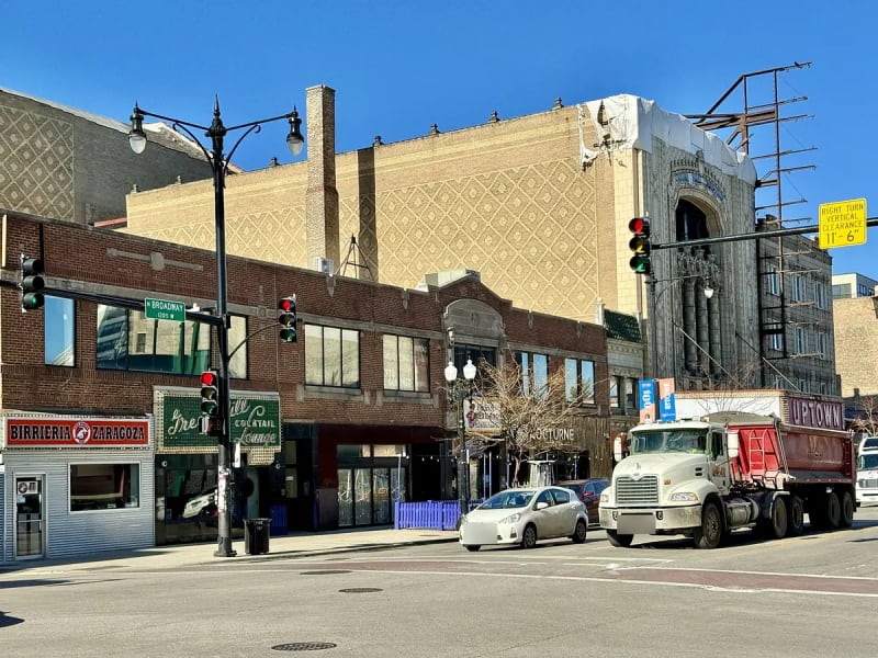 Green Mill sign and storefronts on Broadway at Lawrence Avenue in Uptown Square, Chicago